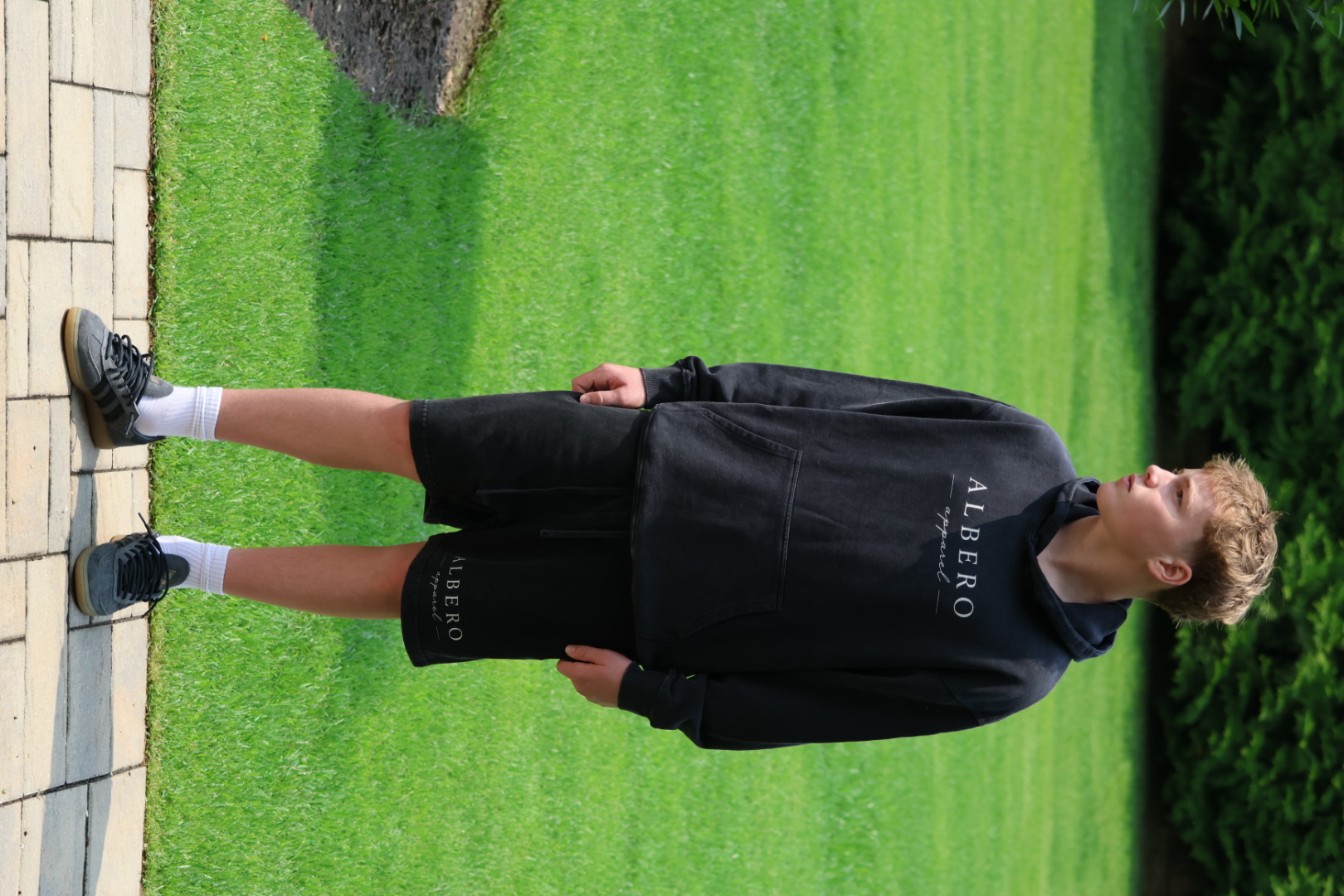 Albero Apparel — model wearing the snow-washed hoodie and OG shorts